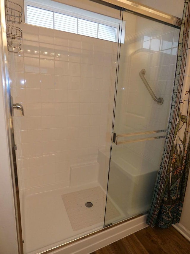 502 Silver Falls St, Joliet, IL 60431 - bathroom featuring a shower stall and wood finished floors
