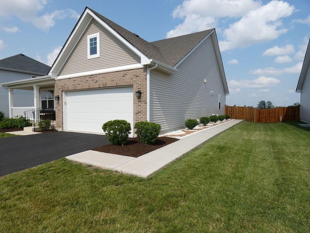 502 Silver Falls St, Joliet, IL 60431 - view of front of house with driveway, brick siding, roof with shingles, and an attached garage