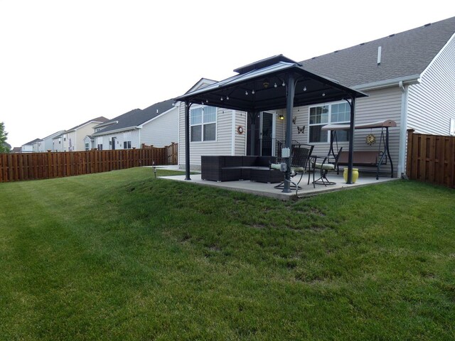 502 Silver Falls St, Joliet, IL 60431 - rear view of property featuring a gazebo, a patio area, an outdoor hangout area, and a shingled roof