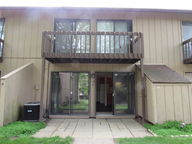 13 Saint Thomas Colony Unit 2, Fox Lake, IL 60020 - rear view of property with cooling unit, a balcony, and a patio
