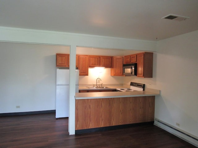 13 Saint Thomas Colony Unit 2, Fox Lake, IL 60020 - kitchen featuring white appliances, a sink, a baseboard radiator, brown cabinetry, and light countertops