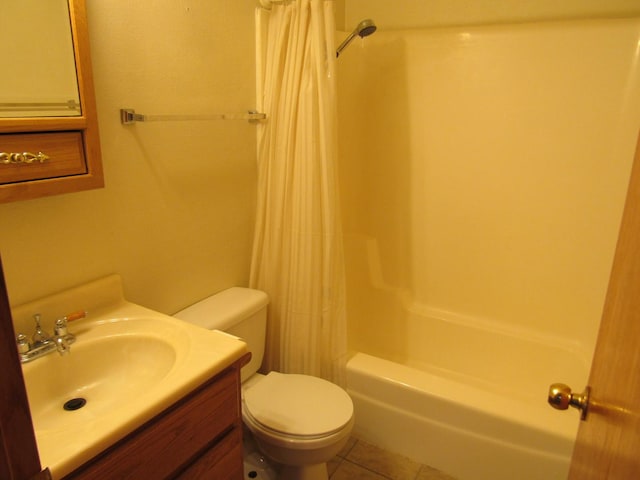 13 Saint Thomas Colony Unit 2, Fox Lake, IL 60020 - bathroom featuring tile patterned flooring, toilet, shower / bath combo with shower curtain, and vanity