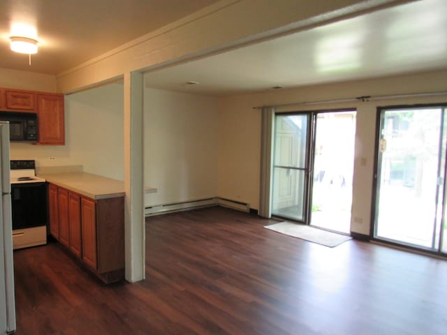 13 Saint Thomas Colony Unit 2, Fox Lake, IL 60020 - kitchen featuring electric range, black microwave, baseboard heating, dark wood finished floors, and brown cabinets