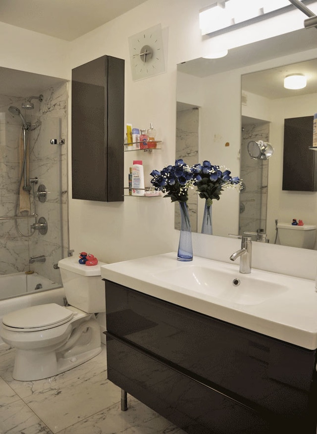 6007 N Sheridan Rd Unit 38G, Chicago, IL 60660 - bathroom with marble look tile flooring, vanity, and bathing tub / shower combination
