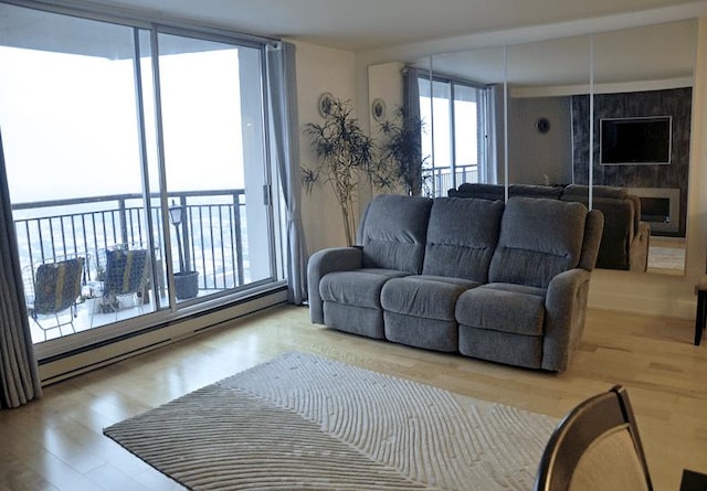 6007 N Sheridan Rd Unit 38G, Chicago, IL 60660 - living area featuring wood finished floors, baseboard heating, and floor to ceiling windows