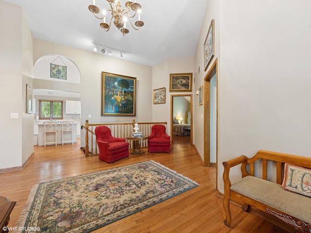1520 Grant St, Schaumburg, IL 60193 - living area featuring a chandelier, wood finished floors, and an upstairs landing