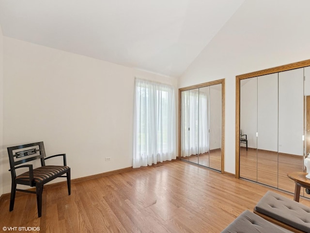 1520 Grant St, Schaumburg, IL 60193 - living area featuring light wood-type flooring and high vaulted ceiling