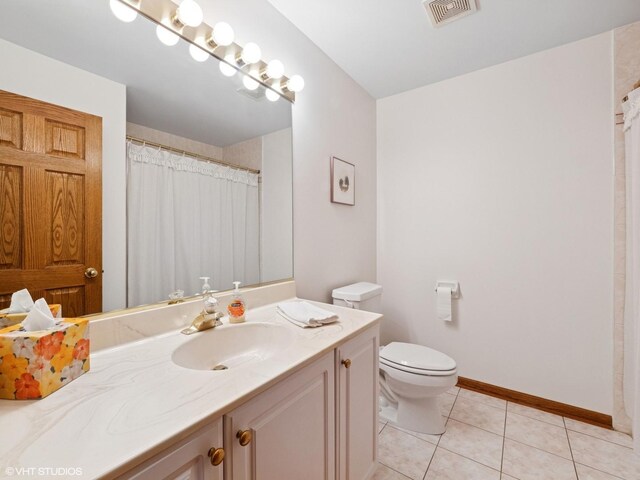 1520 Grant St, Schaumburg, IL 60193 - bathroom with vanity, tile patterned floors, and a shower with curtain