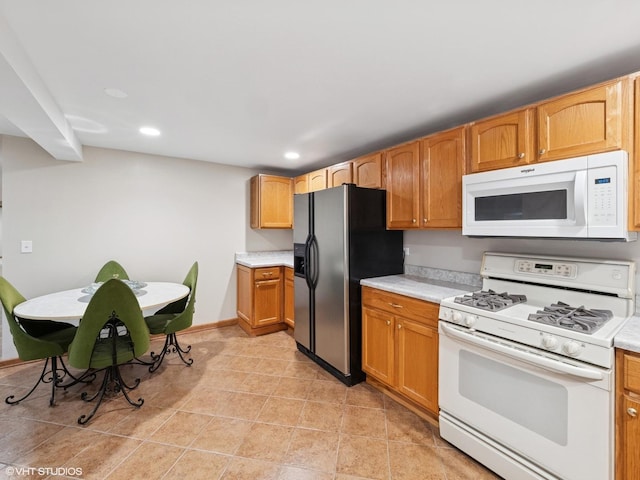 1520 Grant St, Schaumburg, IL 60193 - kitchen featuring white appliances, light countertops, recessed lighting, and light tile patterned floors