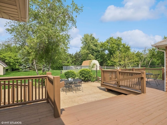 1520 Grant St, Schaumburg, IL 60193 - wooden deck featuring outdoor dining space and view of scattered trees