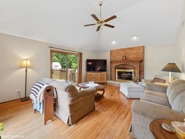 1520 Grant St, Schaumburg, IL 60193 - living area with light wood-style floors, a ceiling fan, recessed lighting, a fireplace, and high vaulted ceiling