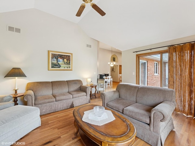 1520 Grant St, Schaumburg, IL 60193 - living area with light wood finished floors, ceiling fan, and high vaulted ceiling