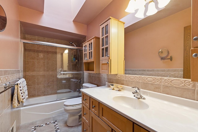 17007 Westwood Ct, Orland Hills, IL 60487 - bathroom with tile walls, toilet, vanity, a chandelier, and shower / bath combination with glass door