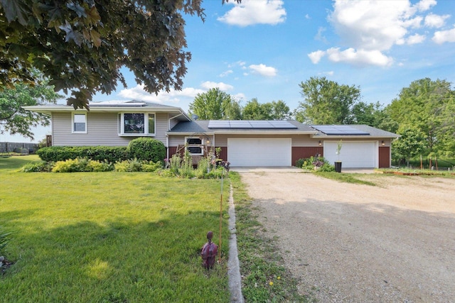 14710 Keslinger Rd, Dekalb, IL 60115 - split level home featuring a front yard, driveway, and solar panels