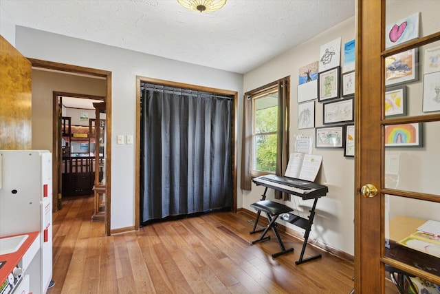 14710 Keslinger Rd, Dekalb, IL 60115 - living area with light wood-style floors and a textured ceiling