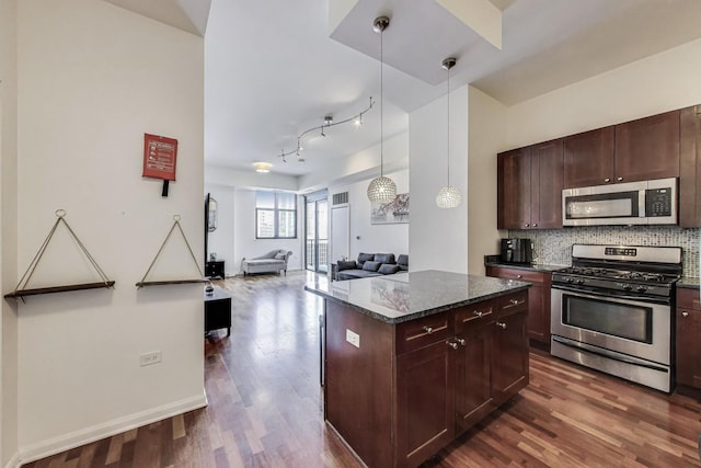 1464 S Michigan Ave Unit 1609, Chicago, IL 60605 - kitchen featuring stainless steel appliances, dark wood-style floors, backsplash, and open floor plan