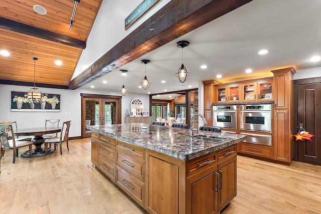 2500 Wahoo Ct, Morris, IL 60450 - kitchen with a warming drawer, french doors, brown cabinets, recessed lighting, and light wood-type flooring