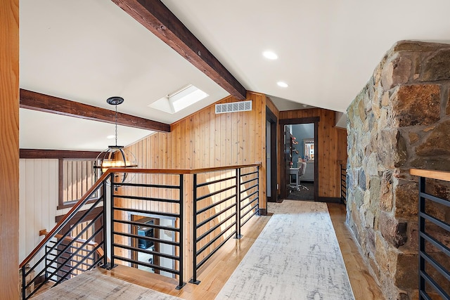 2500 Wahoo Ct, Morris, IL 60450 - corridor with wood walls, a skylight, wood finished floors, an upstairs landing, and a chandelier