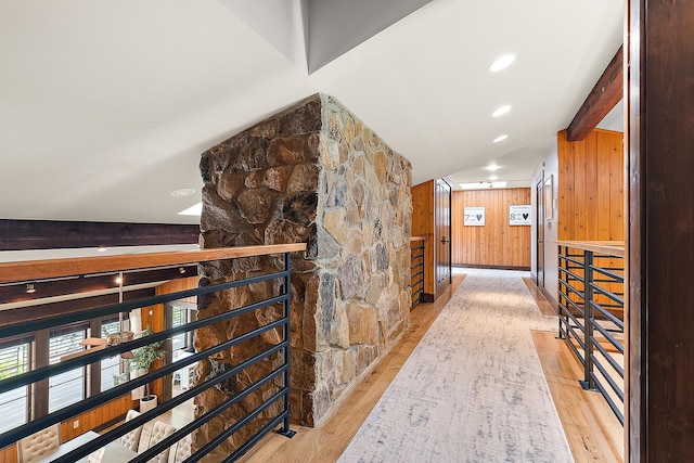 2500 Wahoo Ct, Morris, IL 60450 - hallway featuring wooden walls, wood finished floors, and vaulted ceiling