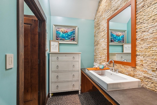 2500 Wahoo Ct, Morris, IL 60450 - bathroom featuring vanity and vaulted ceiling