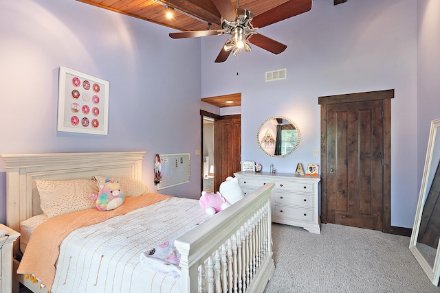 2500 Wahoo Ct, Morris, IL 60450 - bedroom featuring light carpet, wooden ceiling, high vaulted ceiling, and ceiling fan