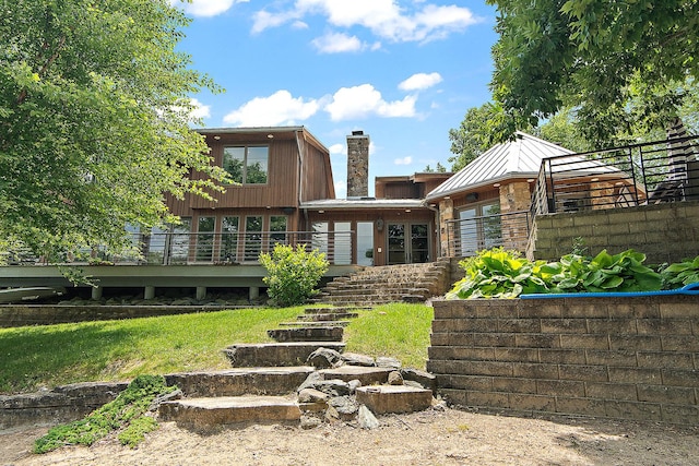 2500 Wahoo Ct, Morris, IL 60450 - back of property featuring stairway, a chimney, a standing seam roof, a deck, and a metal roof
