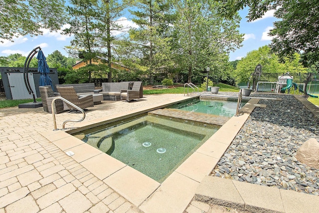2500 Wahoo Ct, Morris, IL 60450 - swimming pool with an in-ground hot tub, a patio area, a playground, and a storage shed