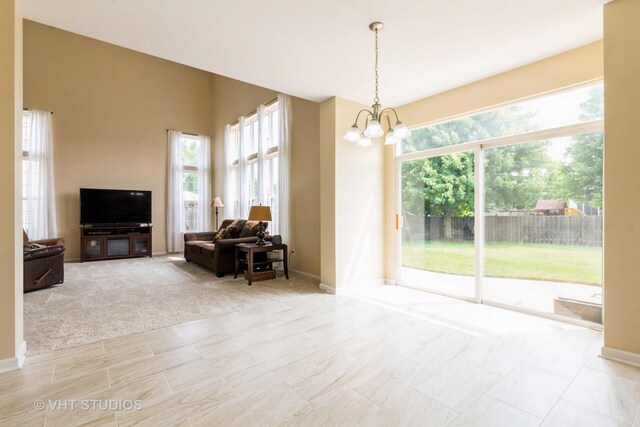2210 Surrey St, Sycamore, IL 60178 - living room with healthy amount of natural light and a chandelier