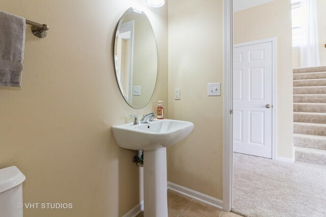 2210 Surrey St, Sycamore, IL 60178 - half bathroom with toilet and tile patterned floors