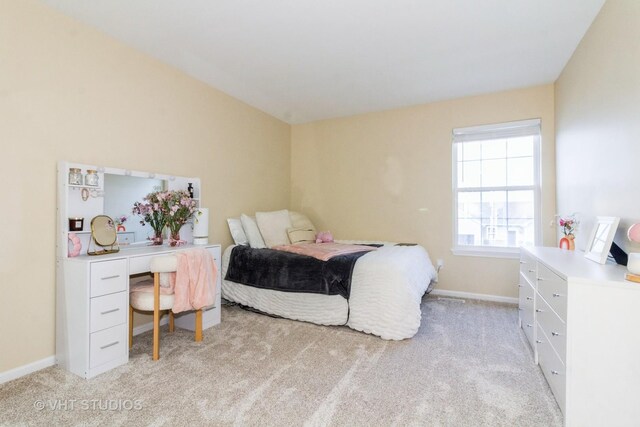 2210 Surrey St, Sycamore, IL 60178 - bedroom featuring light carpet, a desk, and vaulted ceiling