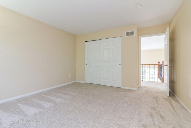 2210 Surrey St, Sycamore, IL 60178 - unfurnished bedroom featuring light colored carpet and a closet