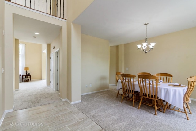 2210 Surrey St, Sycamore, IL 60178 - dining area with a chandelier, carpet flooring, and wood finished floors