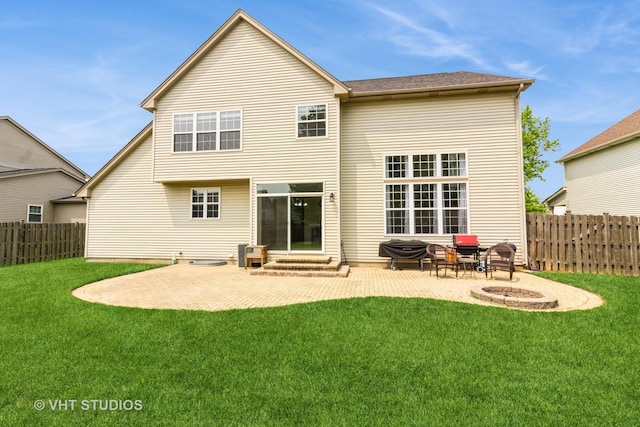 2210 Surrey St, Sycamore, IL 60178 - back of house with a patio area, a fenced backyard, entry steps, and a fire pit