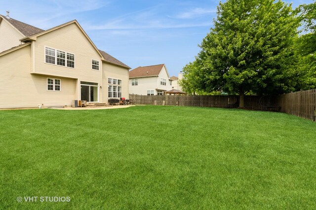 2210 Surrey St, Sycamore, IL 60178 - back of property featuring a fenced backyard and a patio