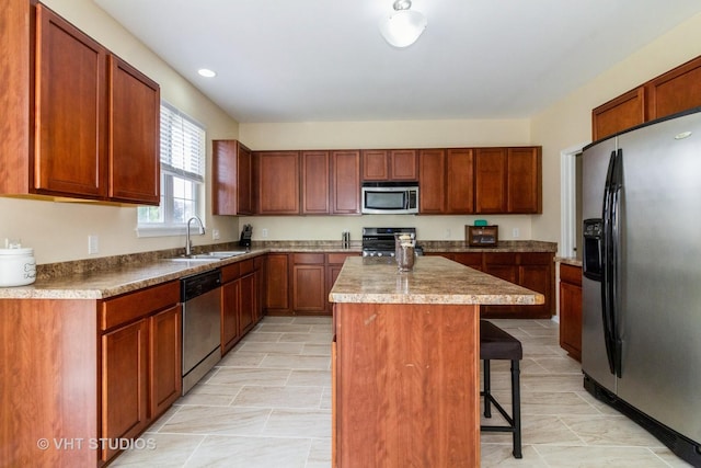 2210 Surrey St, Sycamore, IL 60178 - kitchen with stainless steel appliances, a kitchen bar, a center island, and recessed lighting