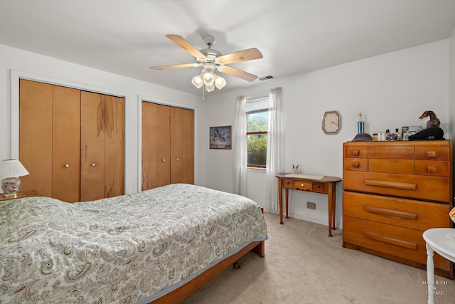 27405 N Roberts Ln, Island Lake, IL 60042 - bedroom with light carpet, two closets, and a ceiling fan