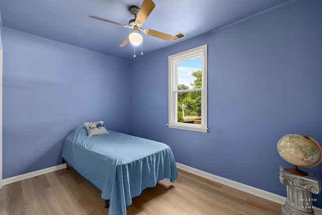 27405 N Roberts Ln, Island Lake, IL 60042 - bedroom featuring wood finished floors, a ceiling fan, and crown molding