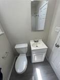 4514 S Honore St, Chicago, IL 60609 - bathroom with vanity and toilet