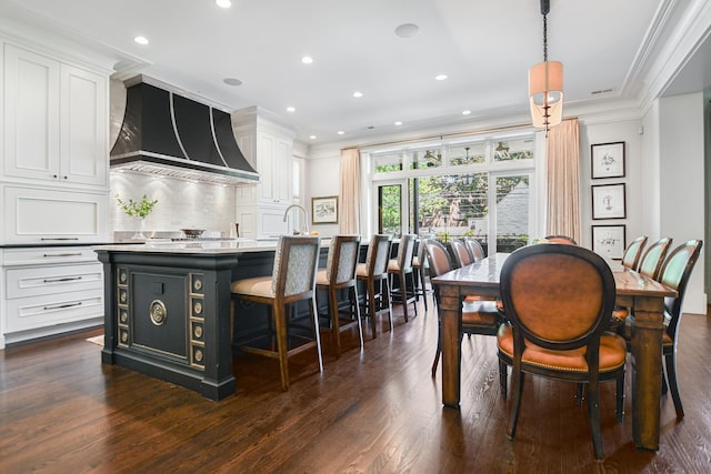 2123 N Bissell St, Chicago, IL 60614 - dining area with dark wood-type flooring, crown molding, and recessed lighting