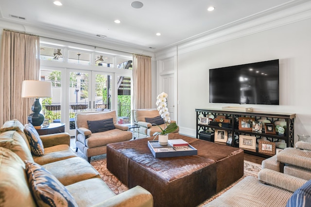 2123 N Bissell St, Chicago, IL 60614 - living area with ornamental molding, french doors, wood finished floors, recessed lighting, and baseboards