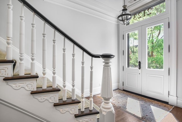 2123 N Bissell St, Chicago, IL 60614 - foyer entrance with stairs, wood finished floors, ornamental molding, and baseboards