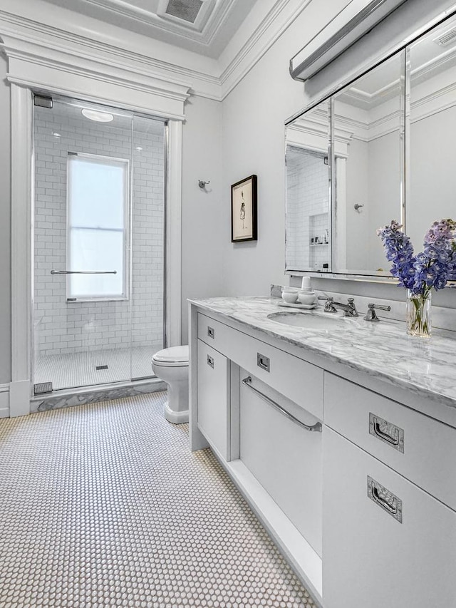 2123 N Bissell St, Chicago, IL 60614 - bathroom with toilet, vanity, crown molding, and a shower stall