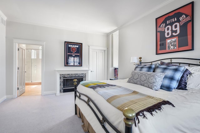 2123 N Bissell St, Chicago, IL 60614 - bedroom featuring ornamental molding, carpet flooring, a tile fireplace, ensuite bathroom, and baseboards