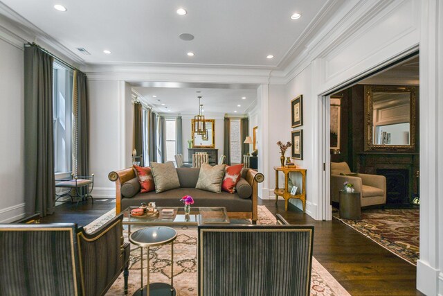 2123 N Bissell St, Chicago, IL 60614 - living room featuring crown molding, dark wood-style floors, baseboards, and recessed lighting