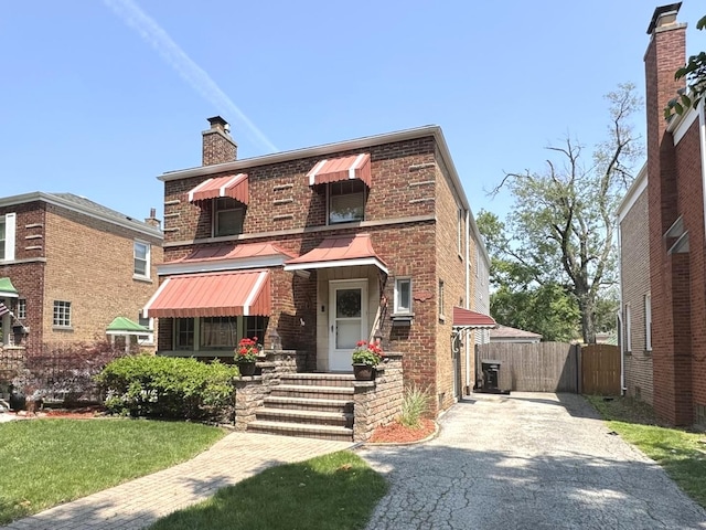 10043 S Artesian Ave, Chicago, IL 60655 - view of front of home with driveway, a chimney, and brick siding