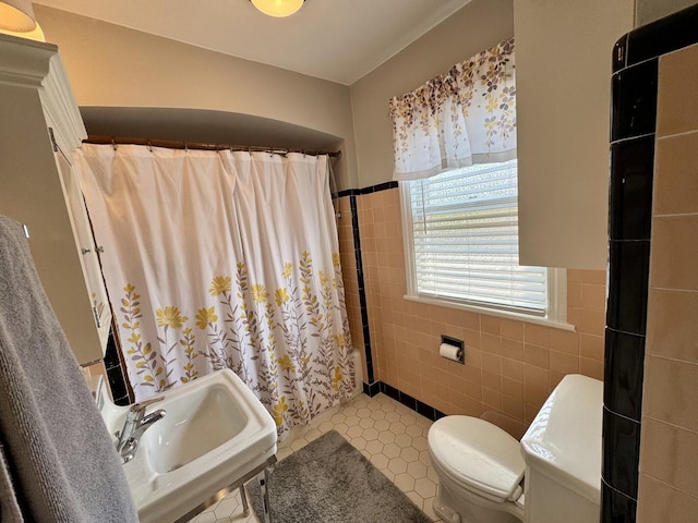 10043 S Artesian Ave, Chicago, IL 60655 - bathroom with tile walls, curtained shower, a wainscoted wall, and tile patterned floors