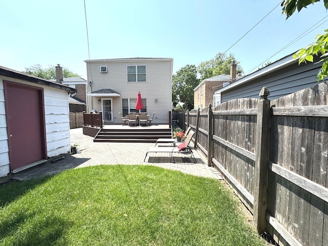 10043 S Artesian Ave, Chicago, IL 60655 - back of property featuring a fenced backyard, a patio, and a deck