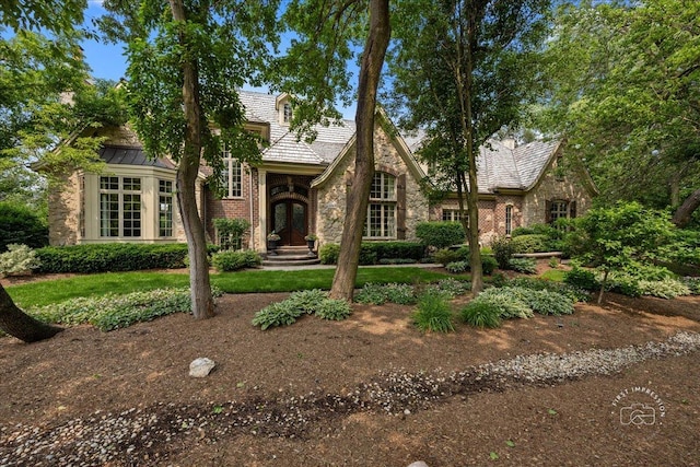 1088 Dunstan Rd, Geneva, IL 60134 - tudor home featuring stone siding and french doors