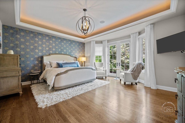 1088 Dunstan Rd, Geneva, IL 60134 - bedroom with a raised ceiling, a chandelier, wood finished floors, access to outside, and wallpapered walls