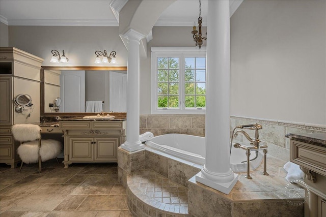 1088 Dunstan Rd, Geneva, IL 60134 - bathroom with ornate columns, vanity, a garden tub, crown molding, and stone finish flooring